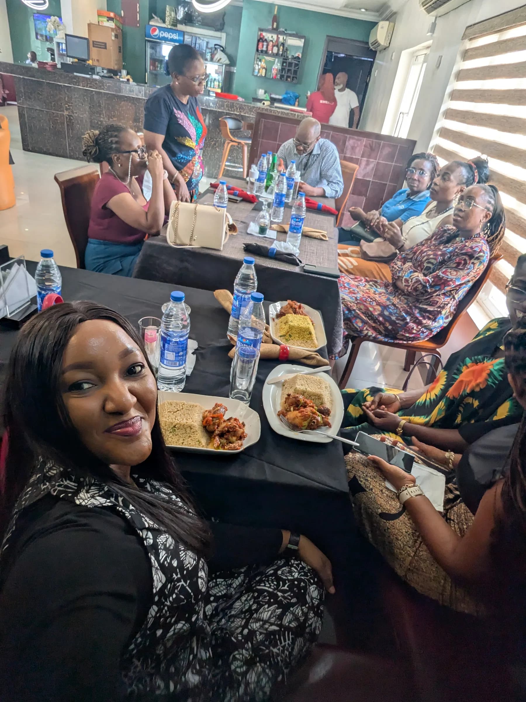 Members seated at tables with refreshments during a chapter gathering.