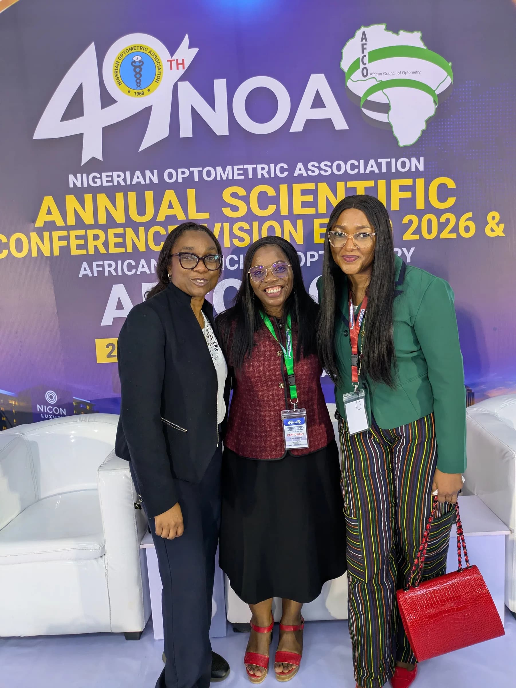 A large group of delegates assembled in front of the 49th NOA conference backdrop.