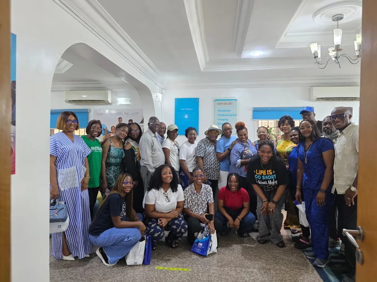 A second wide group photograph of the same gathering.